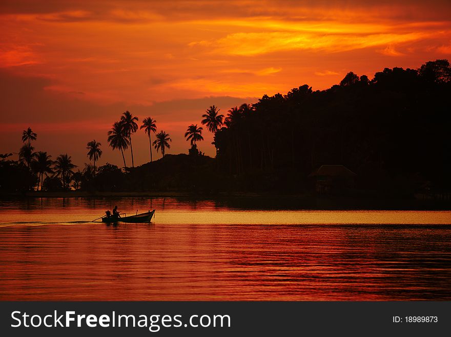 Colorful sunset over the ocean and a boat, Thailand. Colorful sunset over the ocean and a boat, Thailand.