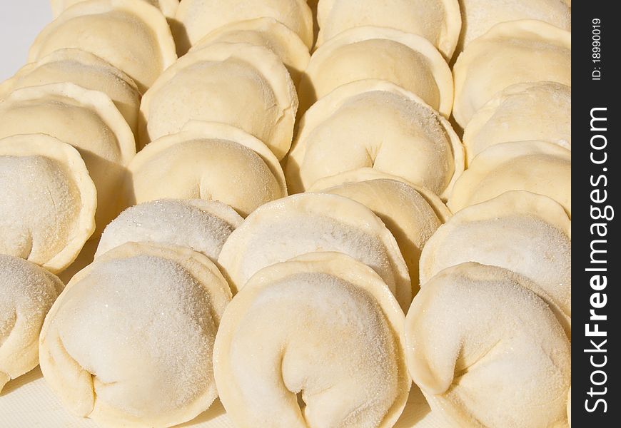 Dumplings hand sculpting, raw and frozen. Culinary prefabricated