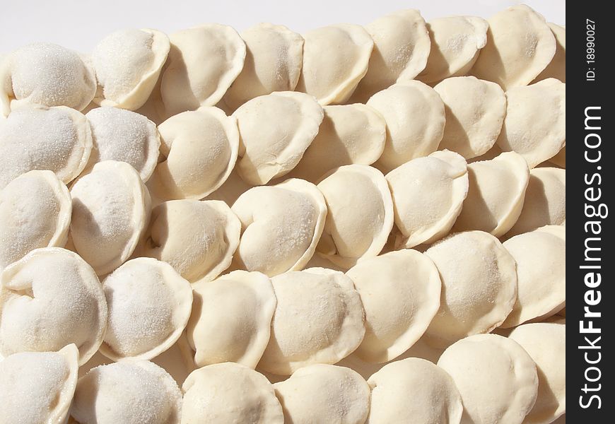 Dumplings hand sculpting, raw and frozen. Culinary prefabricated