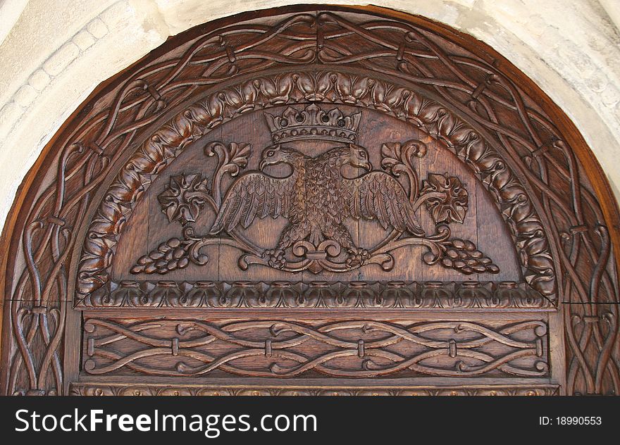 Close up of the top of the wooden door that leads into the Old Church Sinaia Monastery, Sinaia, Romania. Close up of the top of the wooden door that leads into the Old Church Sinaia Monastery, Sinaia, Romania