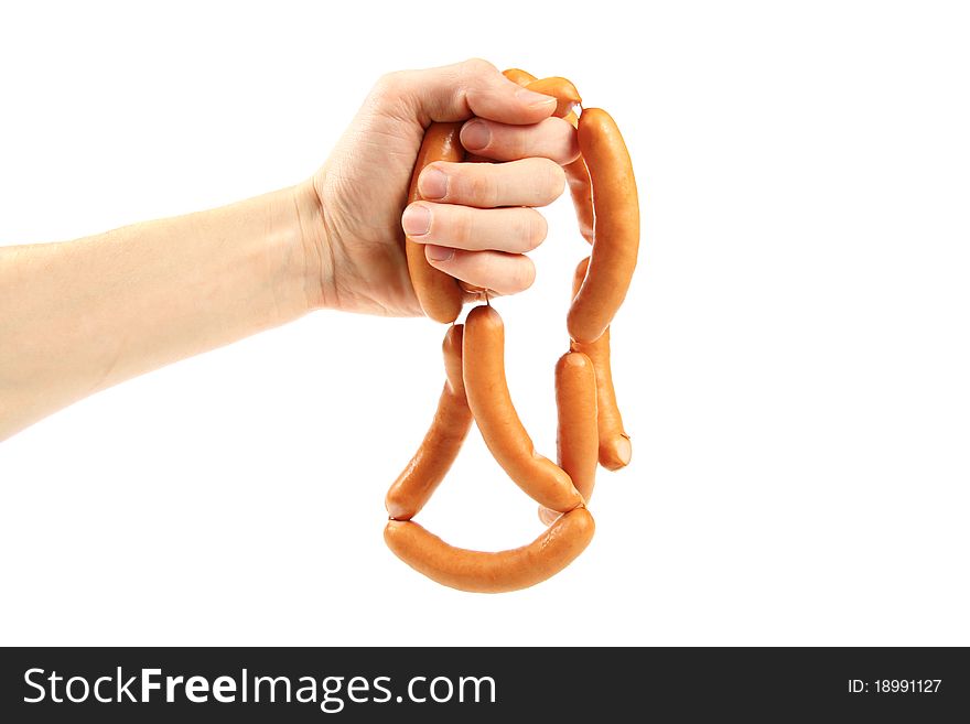 Hand holding bunch of sausages. isolated on white background