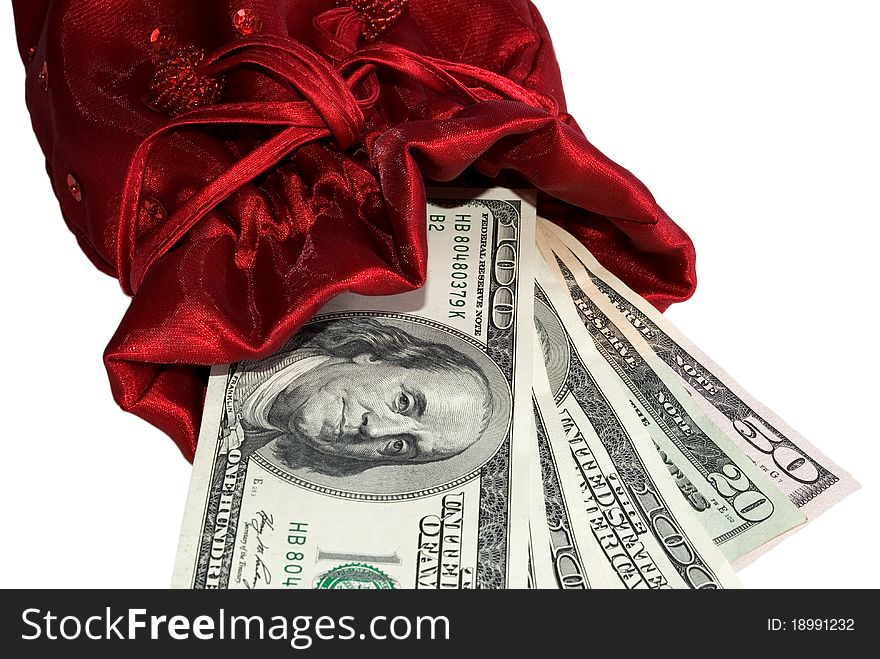 Money as the best gift (dollar bills in a red gift bag isolated on white)