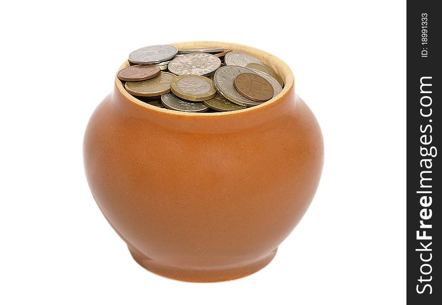 Ceramic pot with metal money on the white background. Ceramic pot with metal money on the white background.