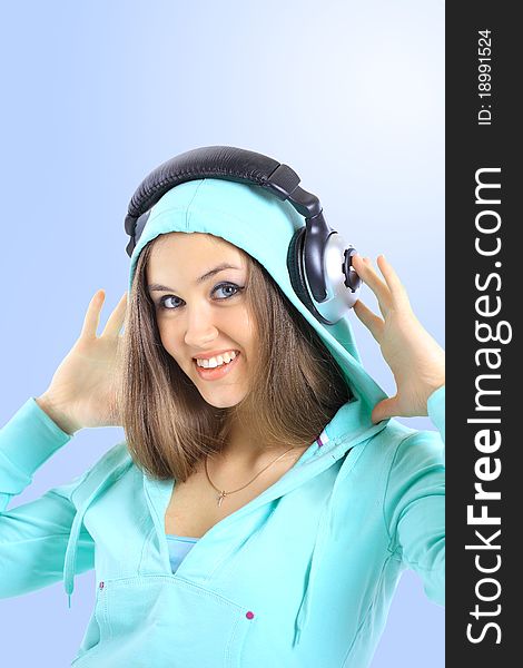 The beautiful young woman with headphones