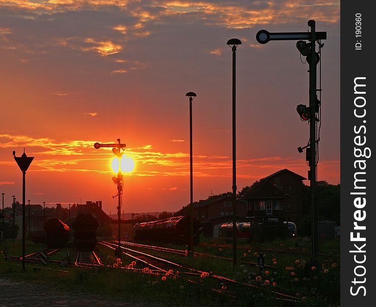 Sunset at a railway station