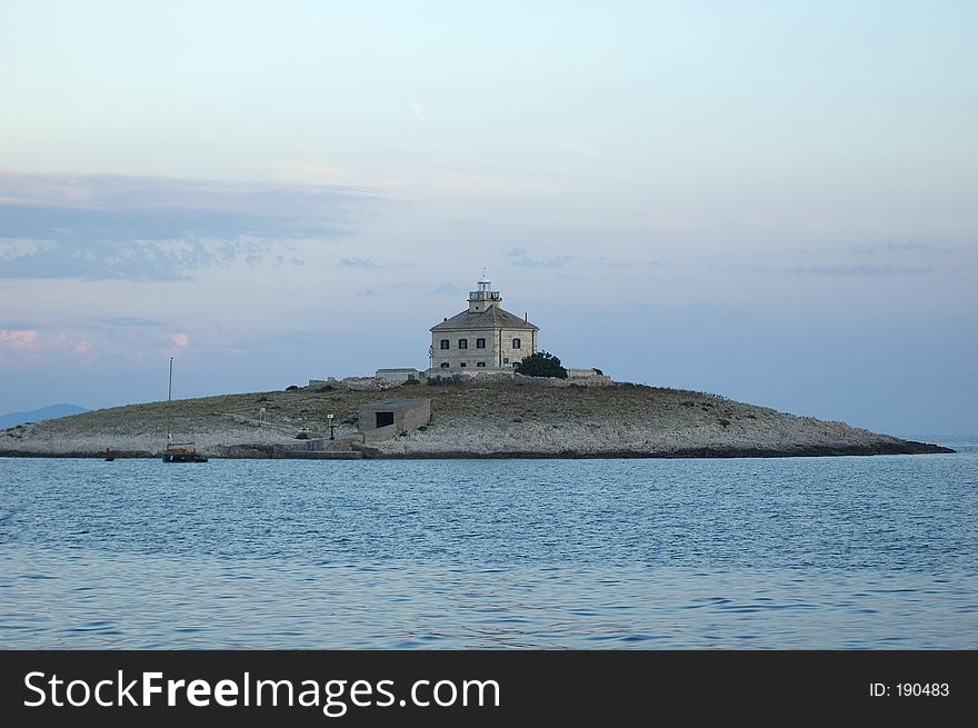 Small church/lighthouse on an isolated island in the Adriatic Sea (Croatia). Small church/lighthouse on an isolated island in the Adriatic Sea (Croatia).