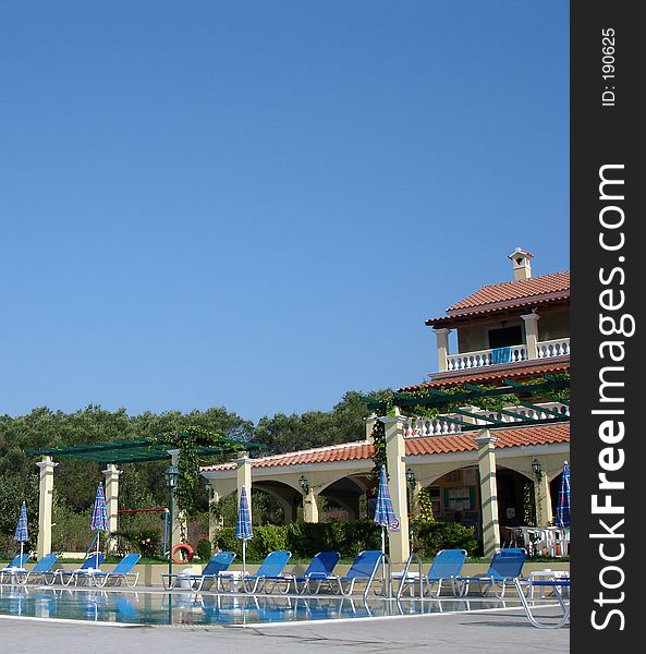 Swimming pool and hotel on a sunny day