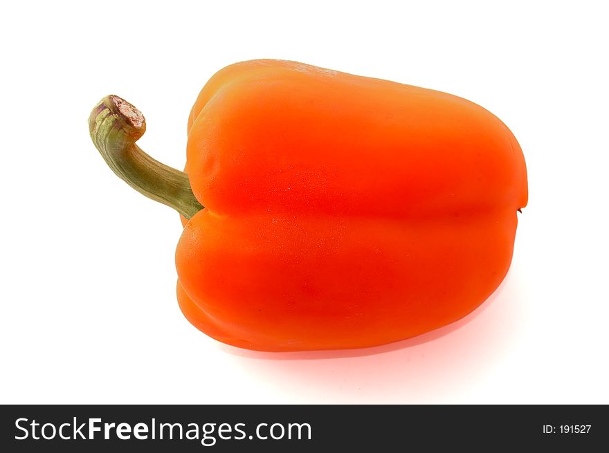 A fresh orange bell pepper over white
