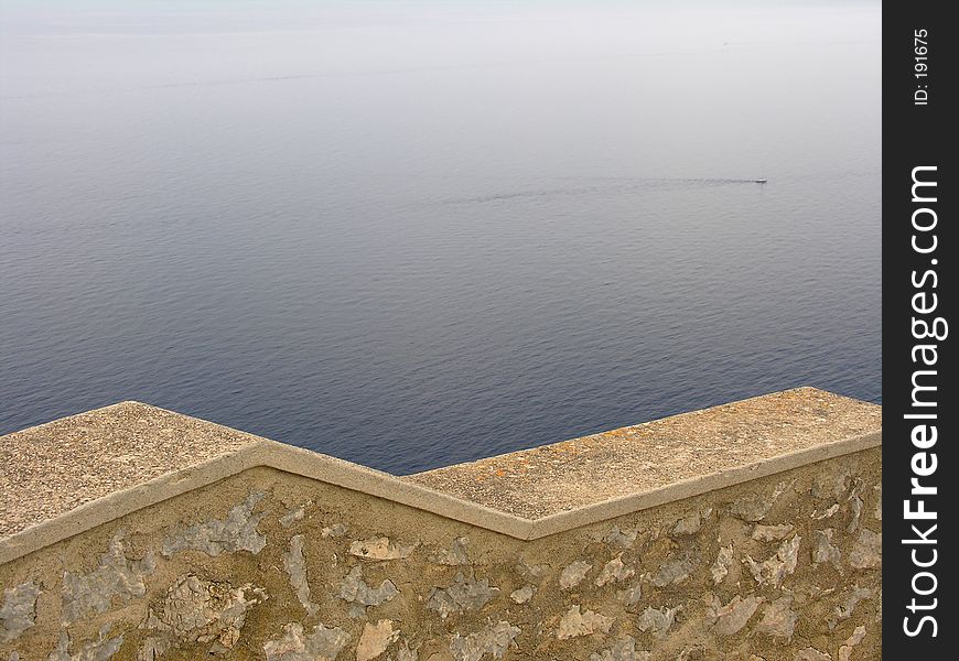 A balustrade high above the mediterranean sea