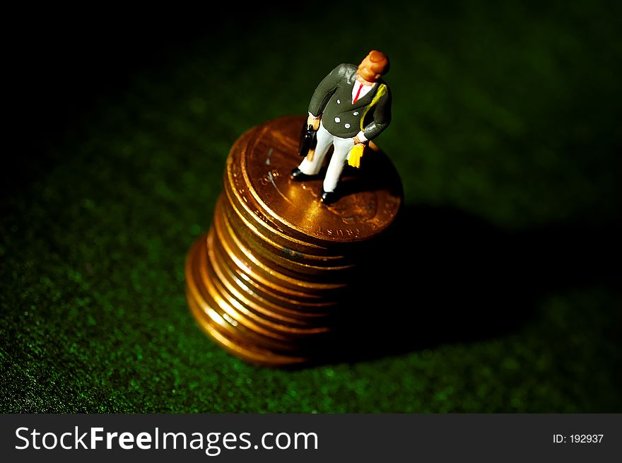 Miniature Businessman Standing on a Stack of Pennies See Portfolio For Similar Concepts. Miniature Businessman Standing on a Stack of Pennies See Portfolio For Similar Concepts.