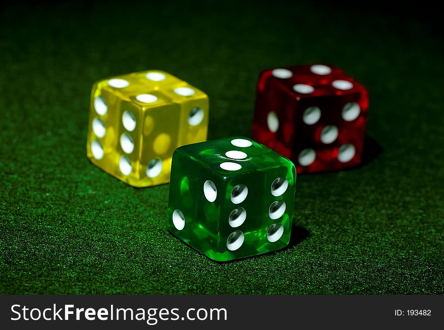 Photo of a Red, Yellow and Green Dice. Photo of a Red, Yellow and Green Dice.