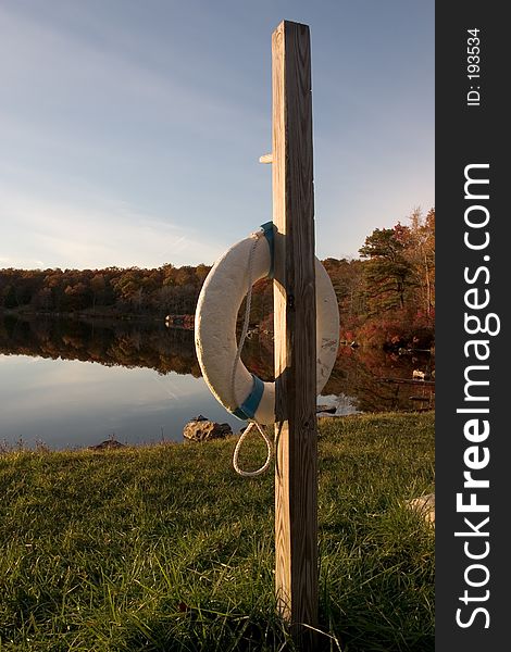 Flotation device at the lake shore at sunset. Flotation device at the lake shore at sunset