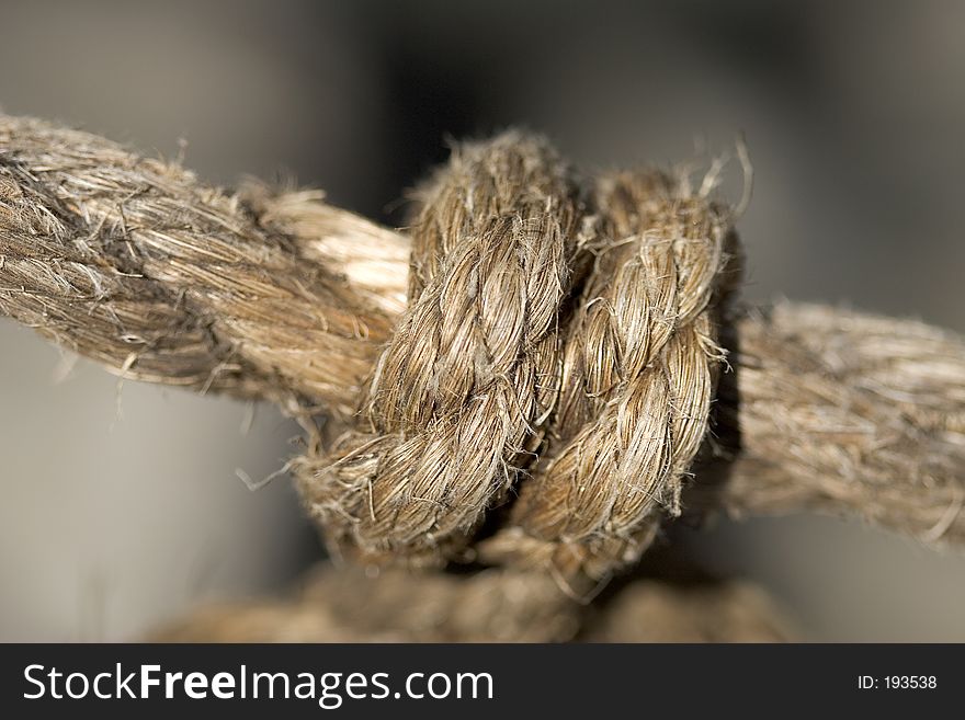 Macro shot of a knot on the old rope