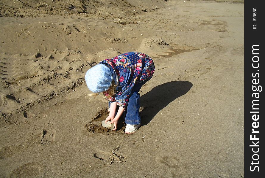 Digital landscape. little girl delighting in finding a rock. Digital landscape. little girl delighting in finding a rock.