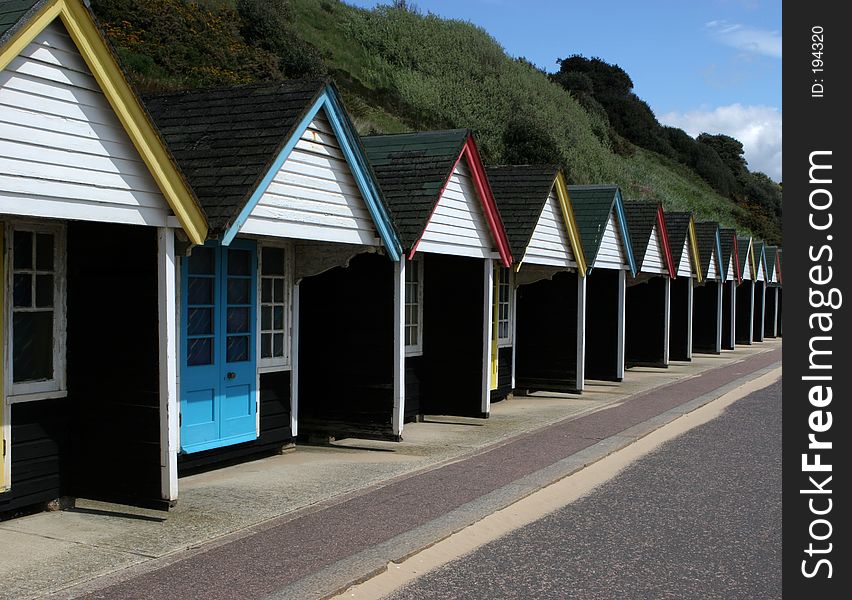 Row of colourful beach huts in the south coast of England