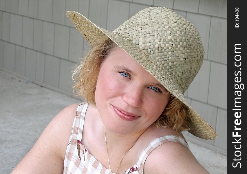 Beautiful young woman with straw hat. Beautiful young woman with straw hat