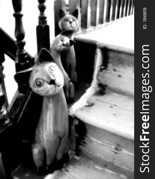 Wooden Cats on Stairs