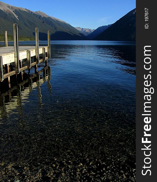 Amazin tranquil lake in New Zealand. Located at the south island in an area called Nelson Lakes. Represents peace, holidays and relax. Amazin tranquil lake in New Zealand. Located at the south island in an area called Nelson Lakes. Represents peace, holidays and relax.