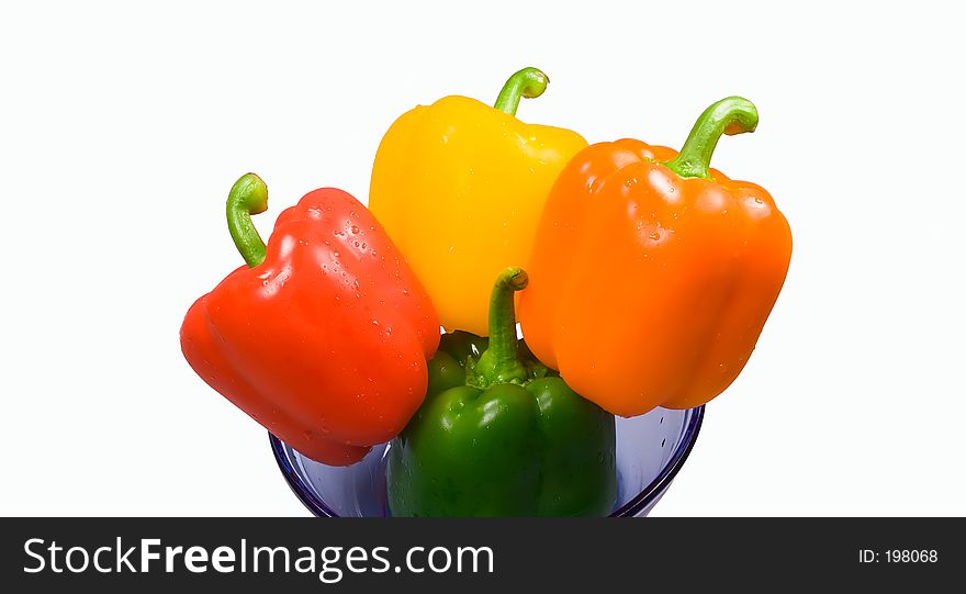Four peppers in a bowl