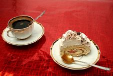 Cup Of Coffee With The Spoon And A Slice Of A Pie On A Red Backg Royalty Free Stock Photo