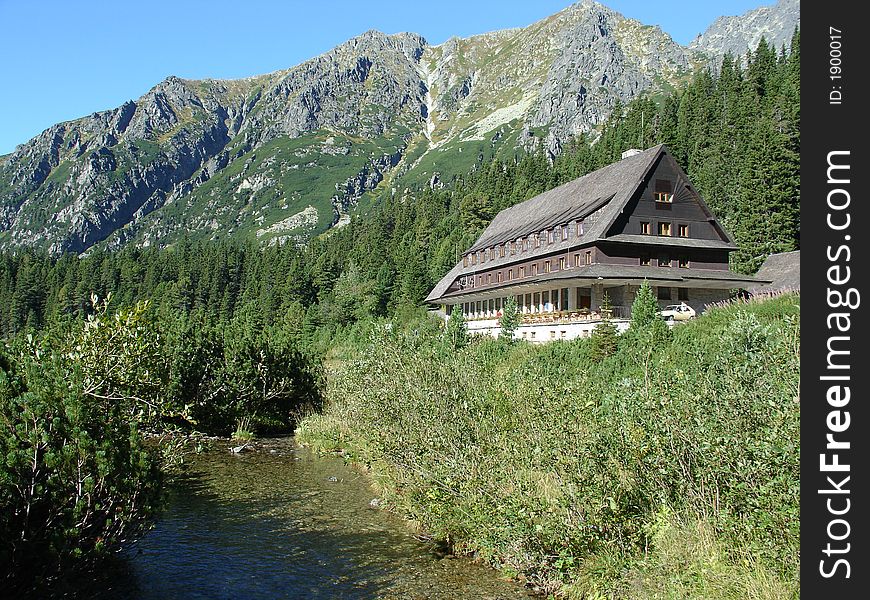 Weekend house near river on mountain.