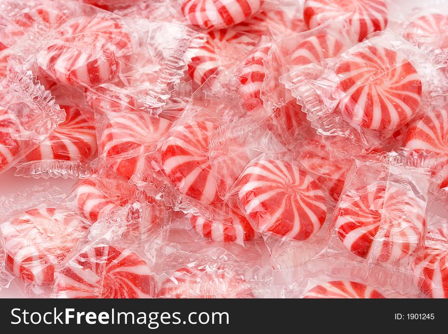 Pile of red and white mint candy in wrapper