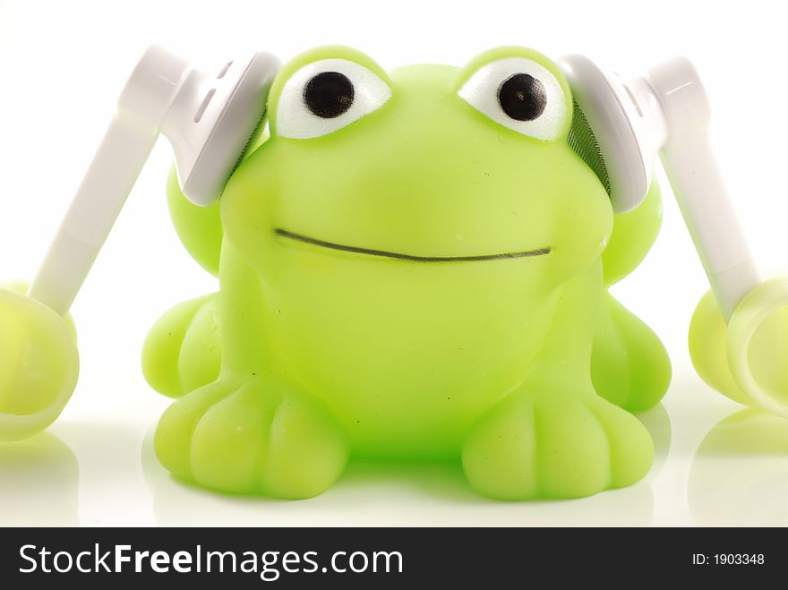 Frog is listening to music. Frog is listening to music