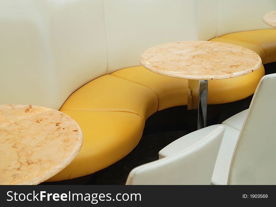 A couch and tables in a cafe. A couch and tables in a cafe
