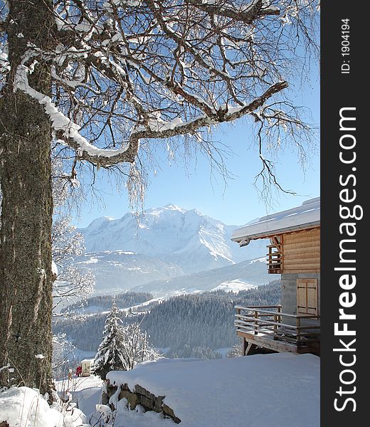 Mountain seen of a snow-covered country cottage. Mountain seen of a snow-covered country cottage