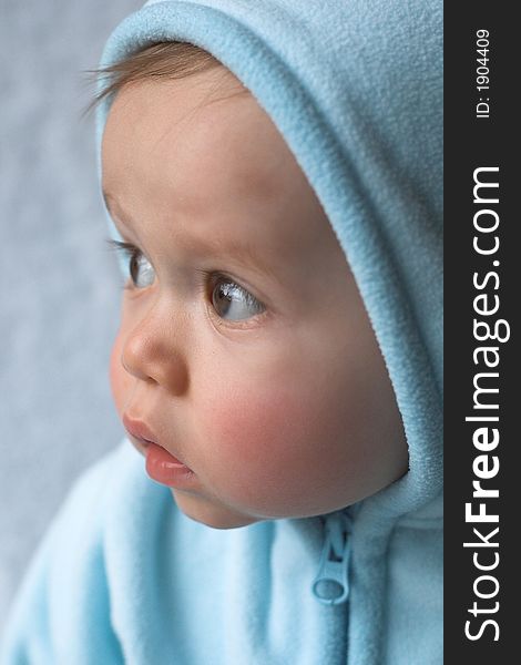 Image of baby wearing a hooded jacket. Image of baby wearing a hooded jacket