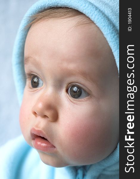 Image of baby wearing a hooded jacket. Image of baby wearing a hooded jacket