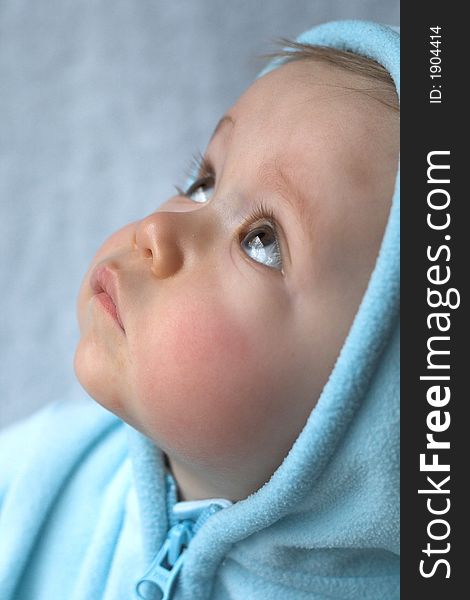 Image of baby wearing a hooded jacket. Image of baby wearing a hooded jacket