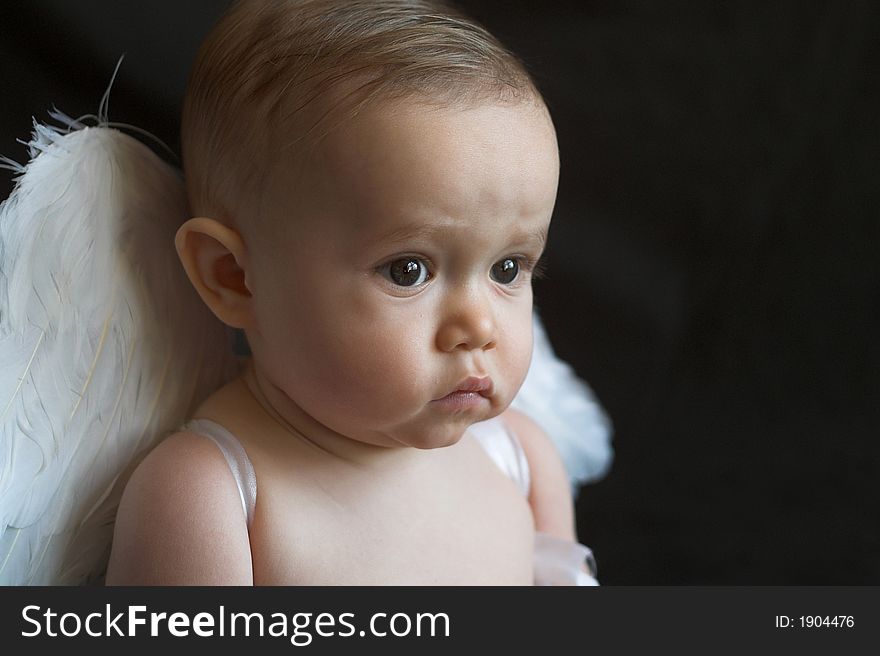 Image of baby wearing angel wings. Image of baby wearing angel wings