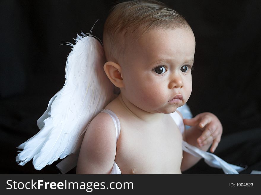 Image of baby wearing angel wings. Image of baby wearing angel wings