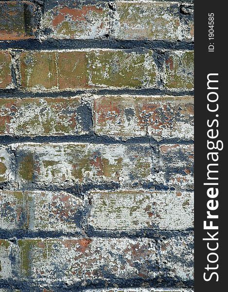Detail of grunge brick wall with chipped paint