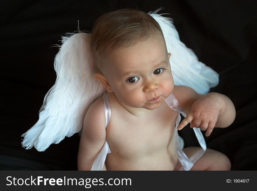 Image of baby wearing angel wings. Image of baby wearing angel wings