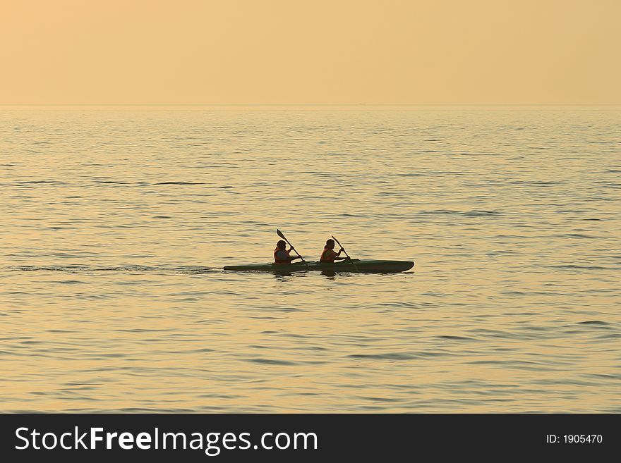 This photo is simply showing two people canoeing.