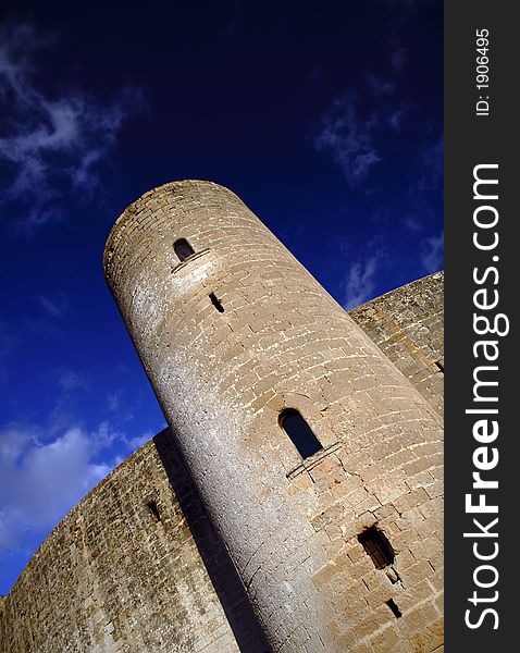 Tower of the castle of bellver in Palma de Mallorca with blue sky. Tower of the castle of bellver in Palma de Mallorca with blue sky