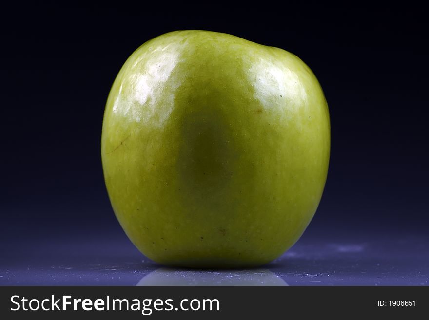Green apple with black bottom