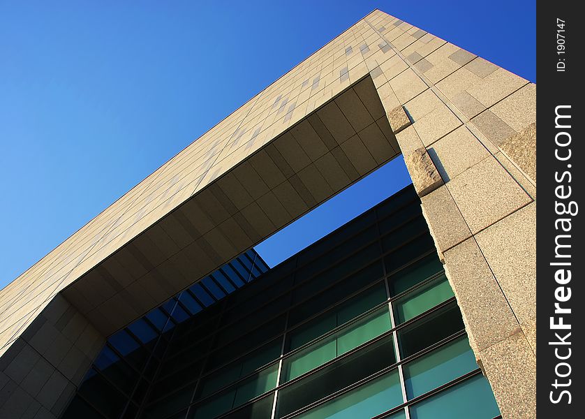 A picture of authority; the lines of a modern building framed against a pure blue sky. A picture of authority; the lines of a modern building framed against a pure blue sky.