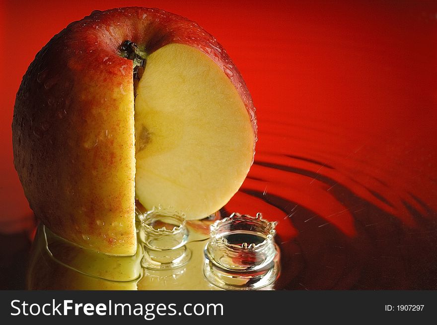 Red apple and water with ripples. Red apple and water with ripples