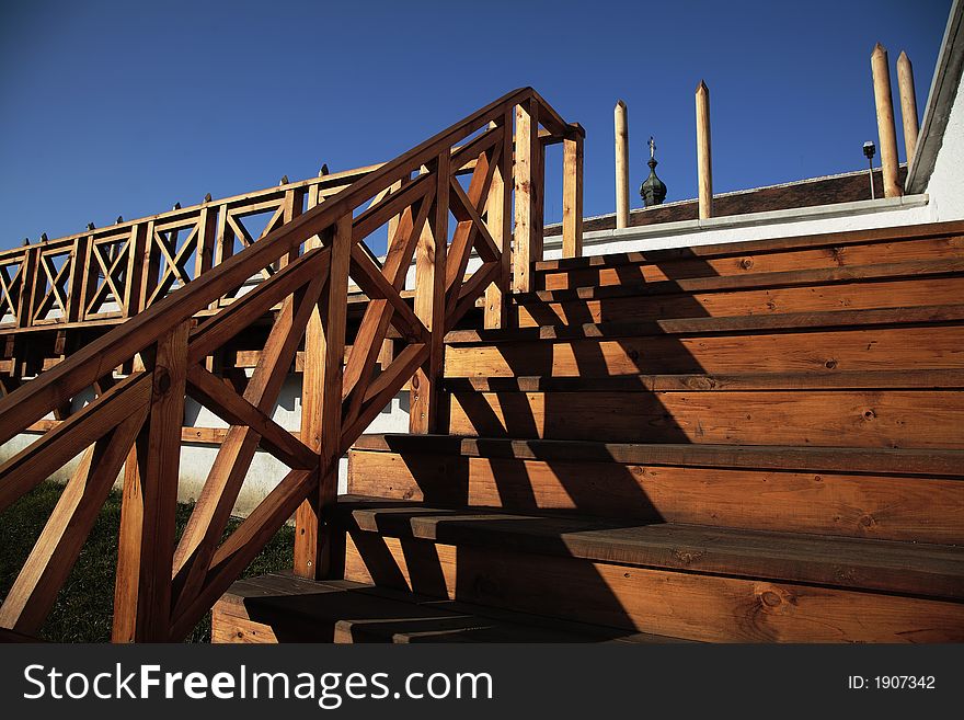 Outdoor wooden stairs with banister