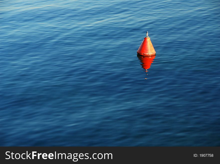 A red float on a lake