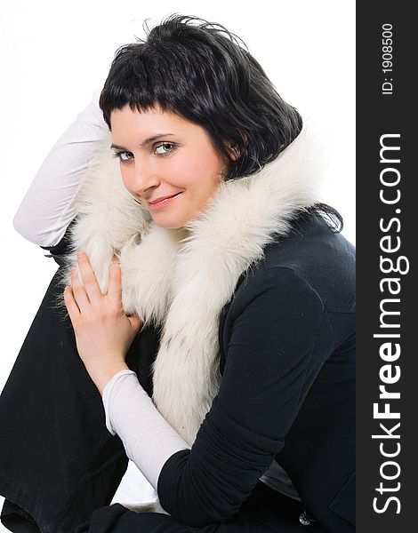 Beauty smiling brunette woman in fur on white background