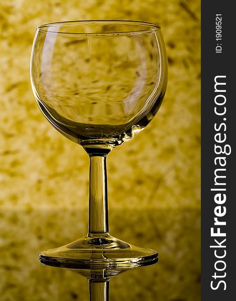The close up of the wine glass on color background