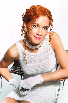 Girl With Red Hair Wearing White And Pearl Stock Images