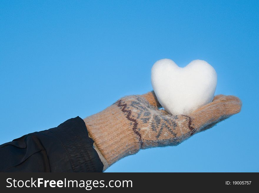 A snowy heart on his hands.