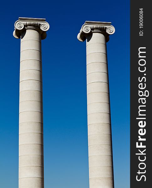 Two massive columns, blue sky