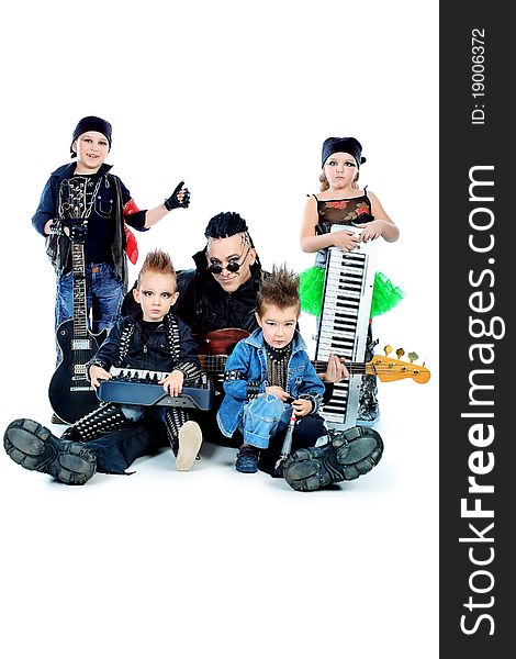 Heavy metal musician with a group of stylish children. Shot in a studio. Isolated over white background. Heavy metal musician with a group of stylish children. Shot in a studio. Isolated over white background.