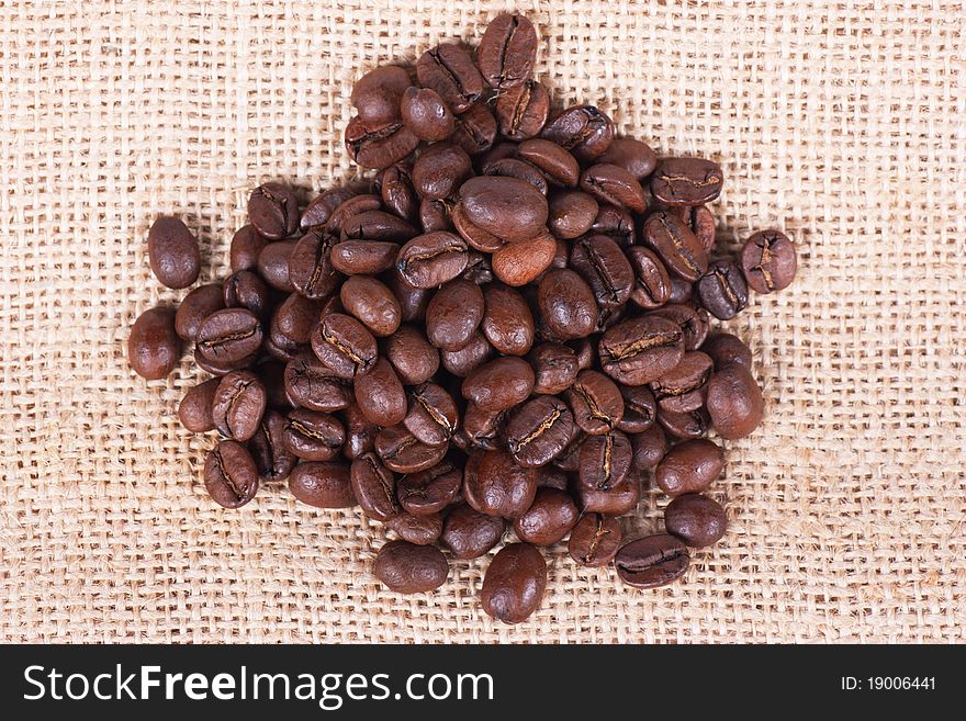 Closeup view of coffee beans on sack